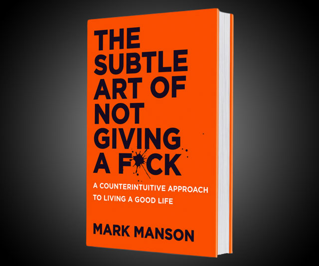 Against a gradient black background is the orange cover for the book, The Subtle Art of Not Giving a Fuck." The letter u in the word Fuck has been censored with a black splatter of ink. Subtitle in white text below reads, A Counterintuitive Approach to Living a Good Life. Author's name in black text at the bottom: Mark Manson.